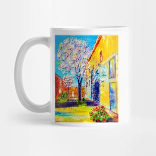 Old city. Blooming tree Mug